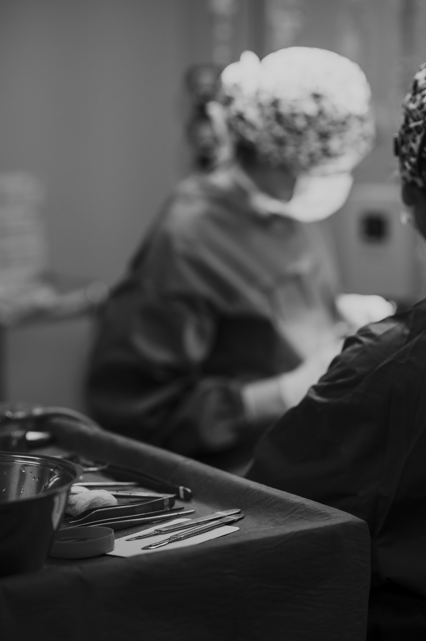 Black and white photo during plastic surgery. Photography by Laura Divella